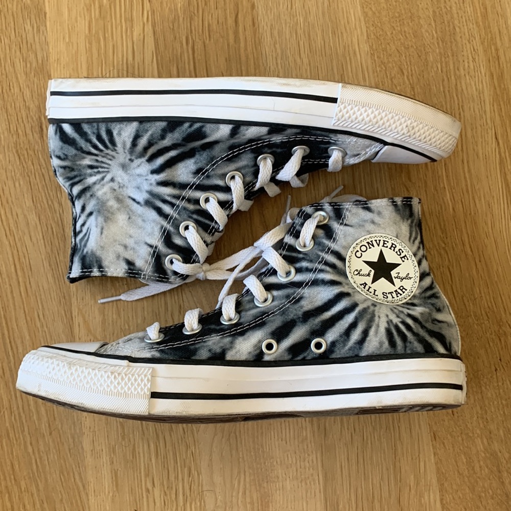 Converse high top black and white tie dye sneakers.